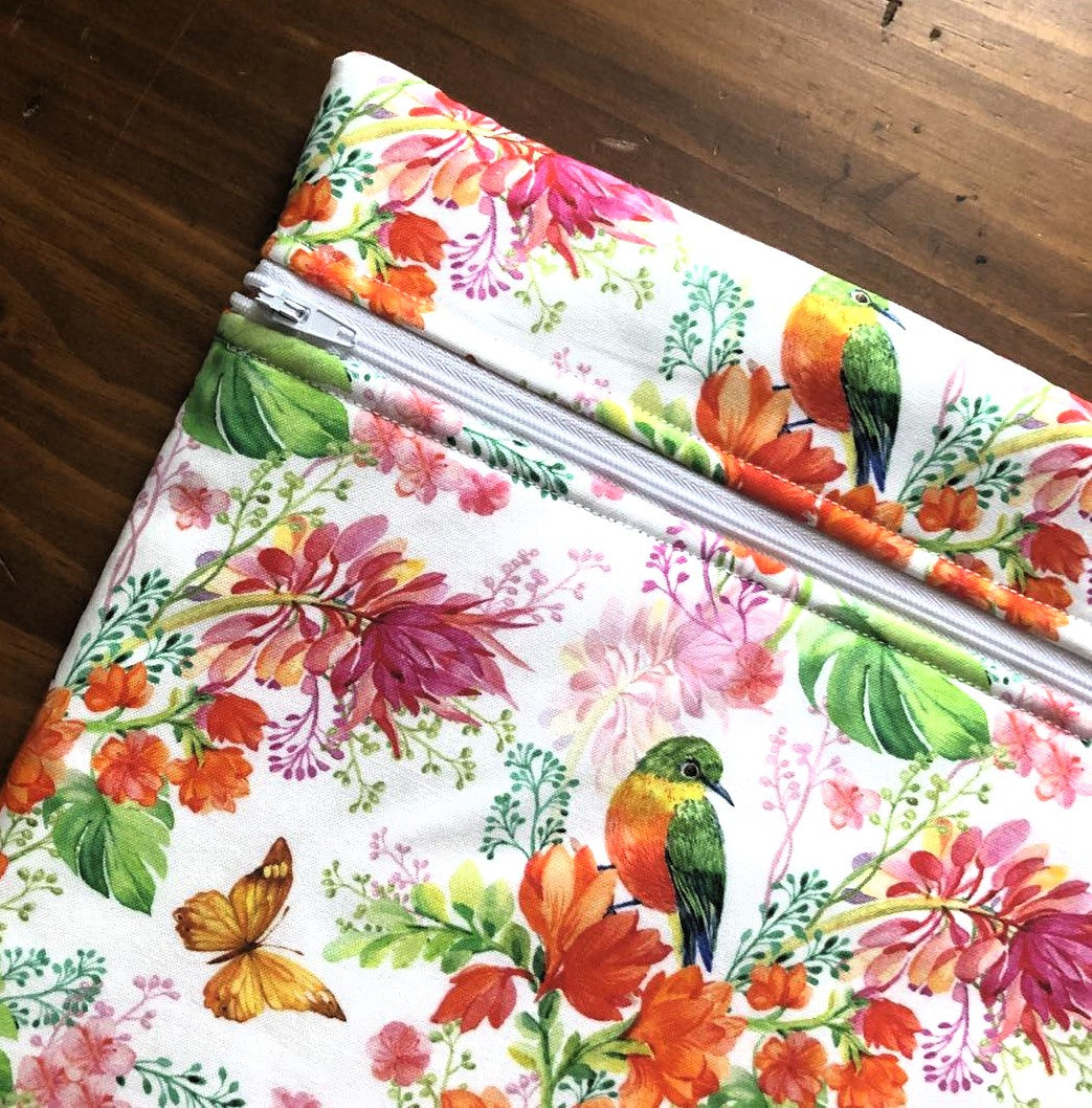Orange floral patterned project bag for cross stitch.