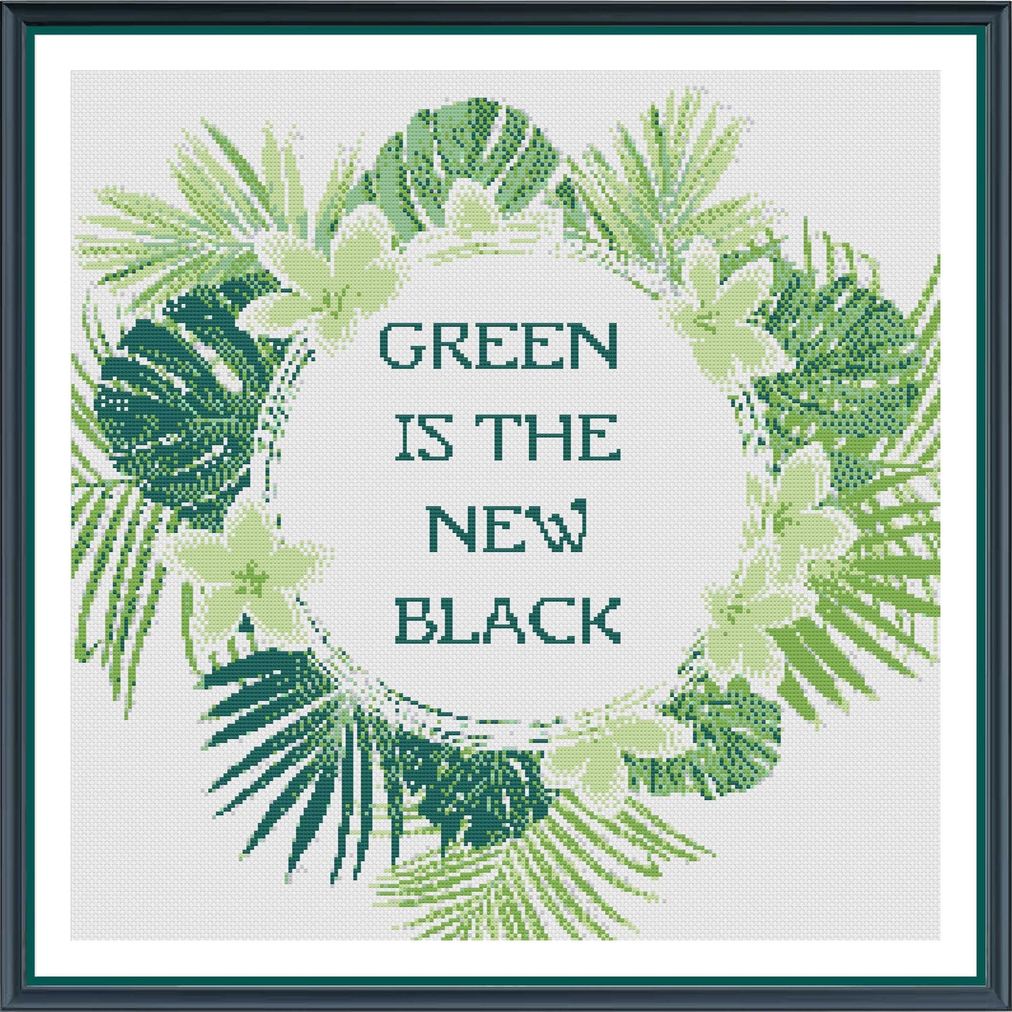 Cross-stitched design with green leaves and 'Green is the New Black' text on a white background.