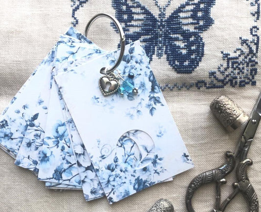 Blue floral themed floss drops for cross stitch thread organisation.