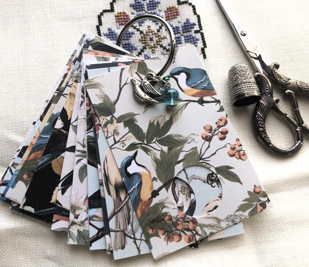 Floral birds themed floss drops for cross stitch thread organisation.