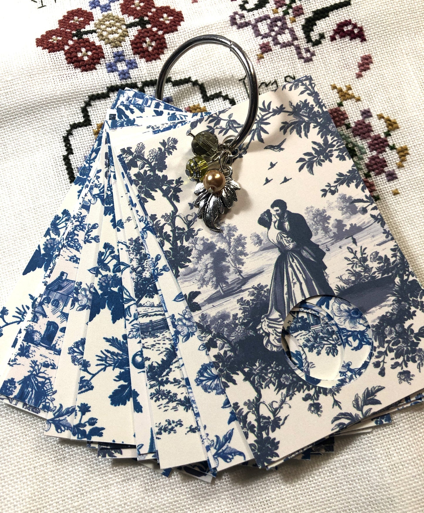 Vintage toile themed floss drops for cross stitch thread organisation.