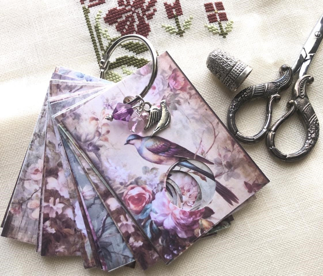 Floral birds floss drops for cross stitch thread organisation.