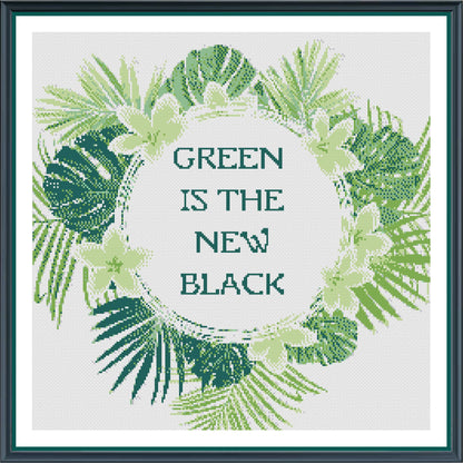 Cross-stitched design with green leaves and 'Green is the New Black' text on a white background.