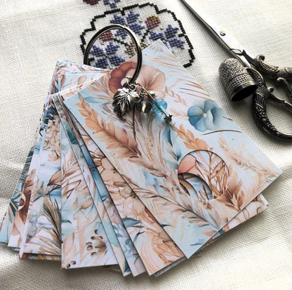 Beach boho themed floss drops for cross stitch thread organisation.