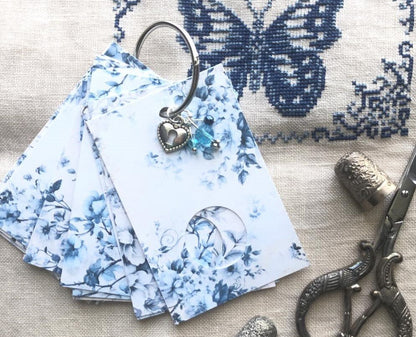 Blue floral themed floss drops for cross stitch thread organisation.