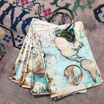 World map themed floss drops for cross stitch thread organisation.