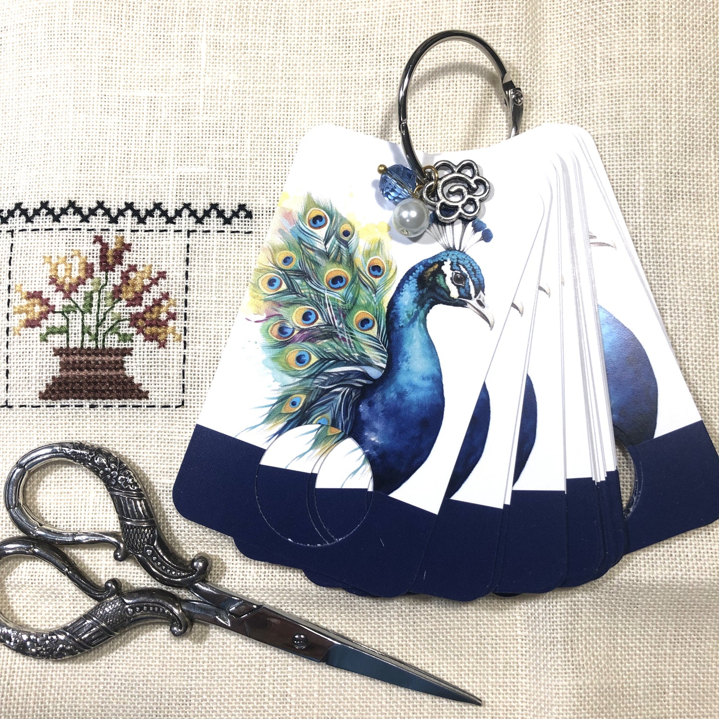 Peacock themed floss drops for cross stitch.