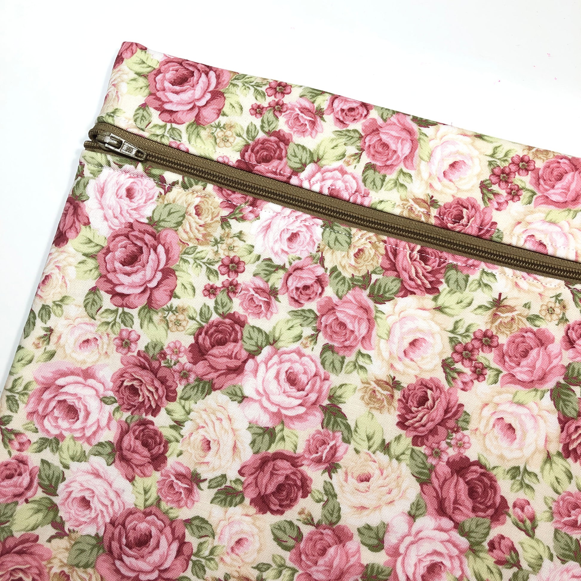 Pink floral patterned project bag for cross stitch.