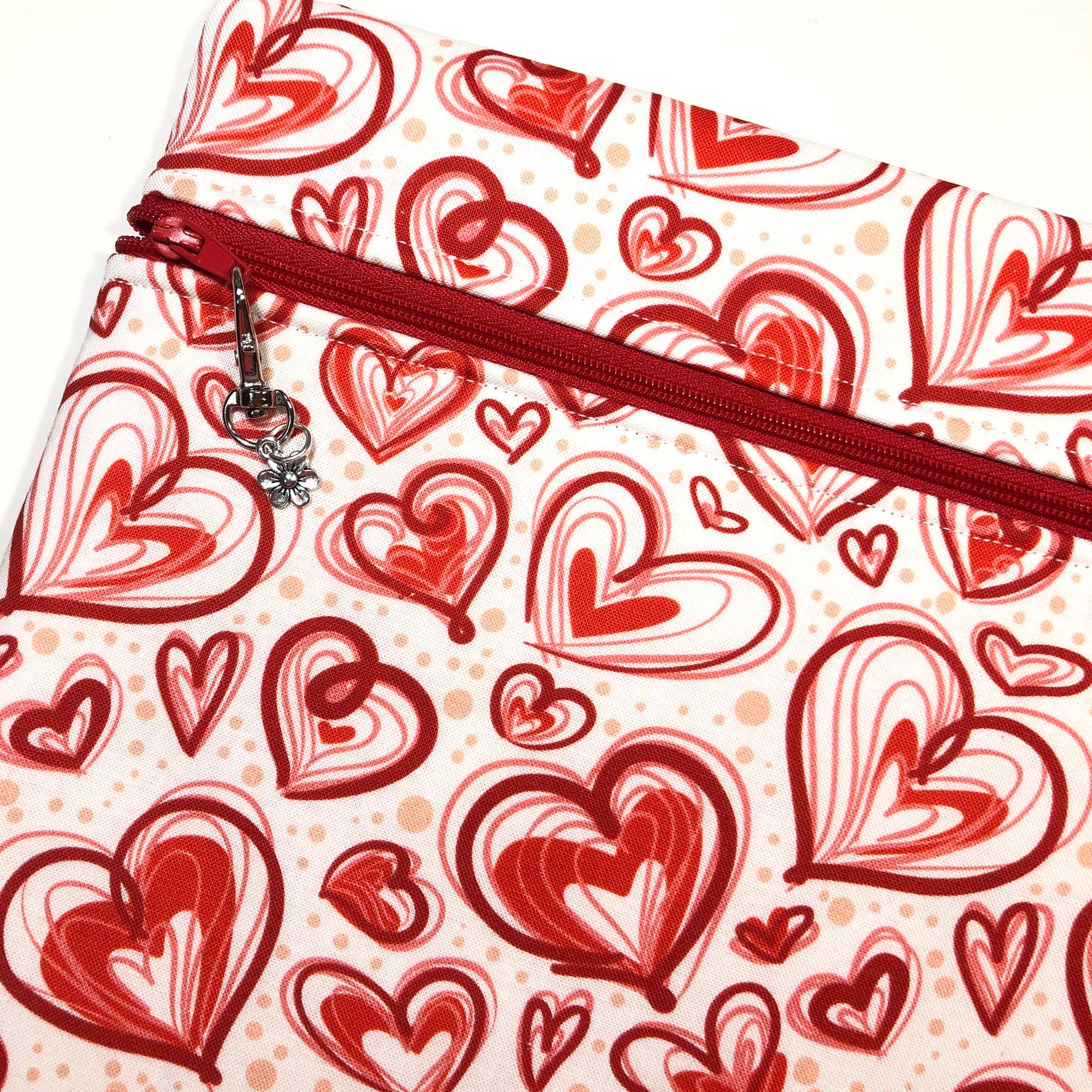 Red heart patterned project bag for cross stitch.