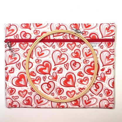 Red heart patterned project bag for cross stitch.