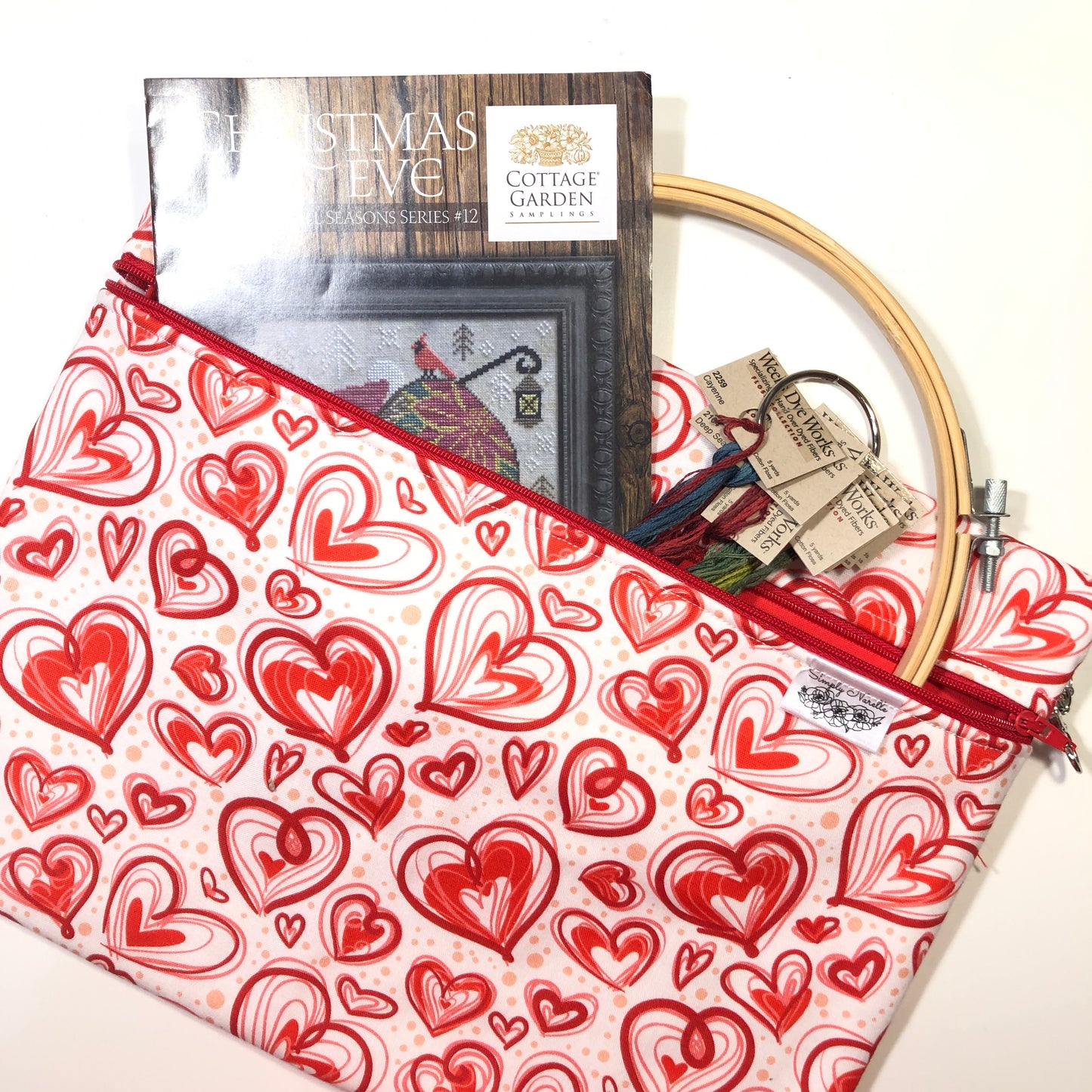 Red heart patterned project bag for cross stitch.