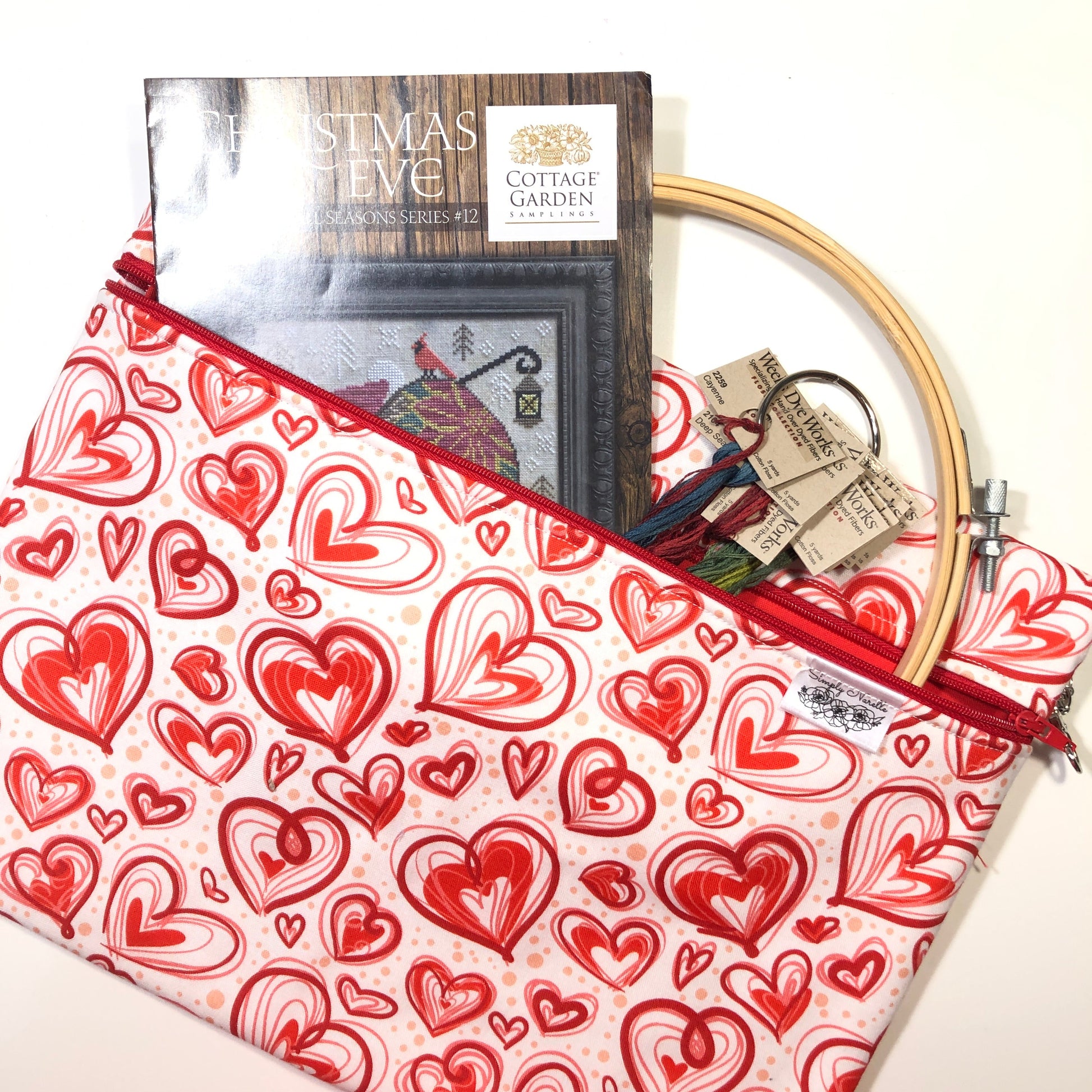 Red heart patterned project bag for cross stitch.