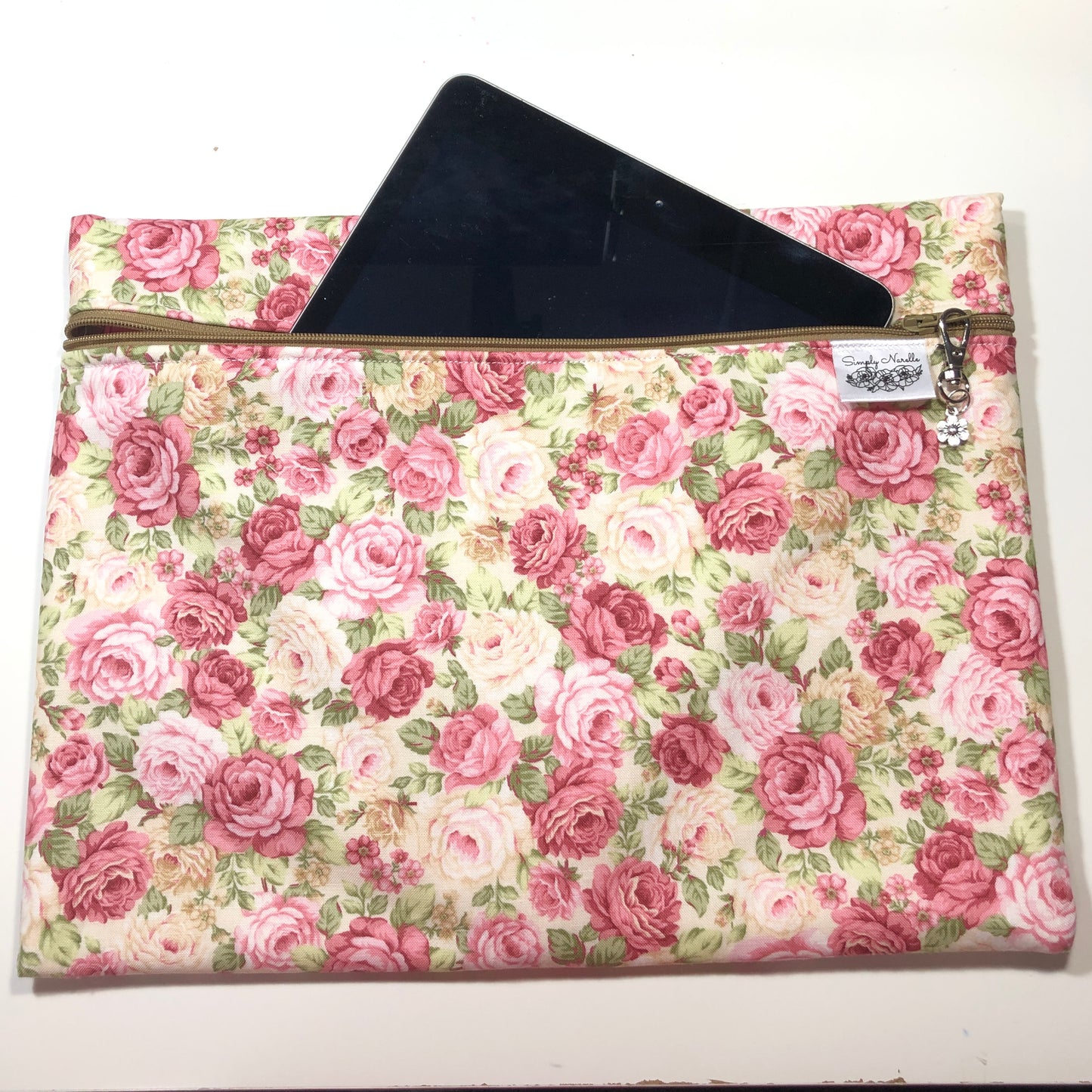 Pink floral patterned project bag for cross stitch.