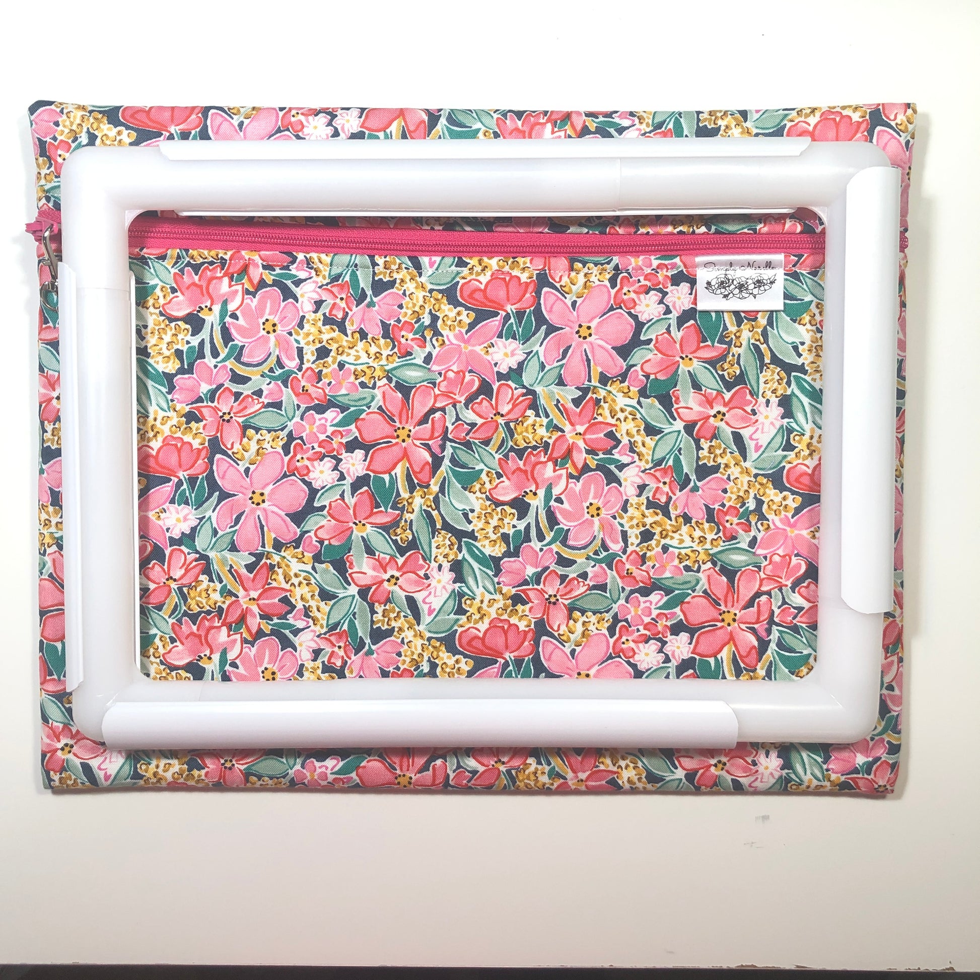 Pink floral project bag for cross stitch.