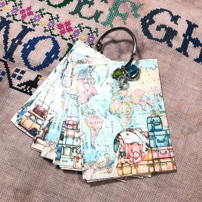 World map themed floss drops for cross stitch thread organisation.