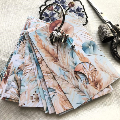 Beach boho themed floss drops for cross stitch thread organisation.