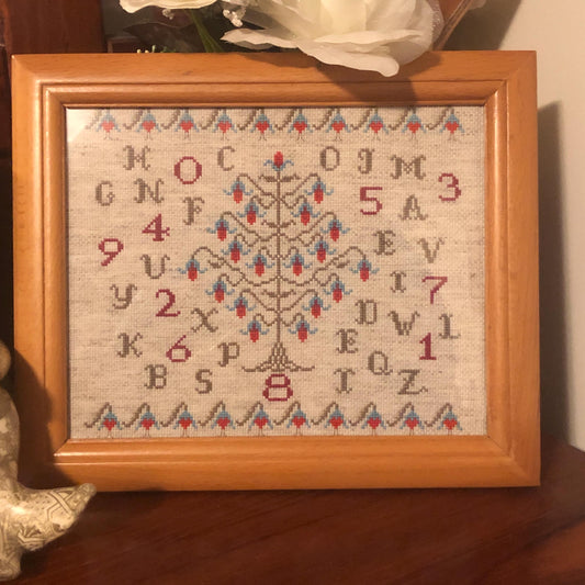 Sampler style cross stitch pattern