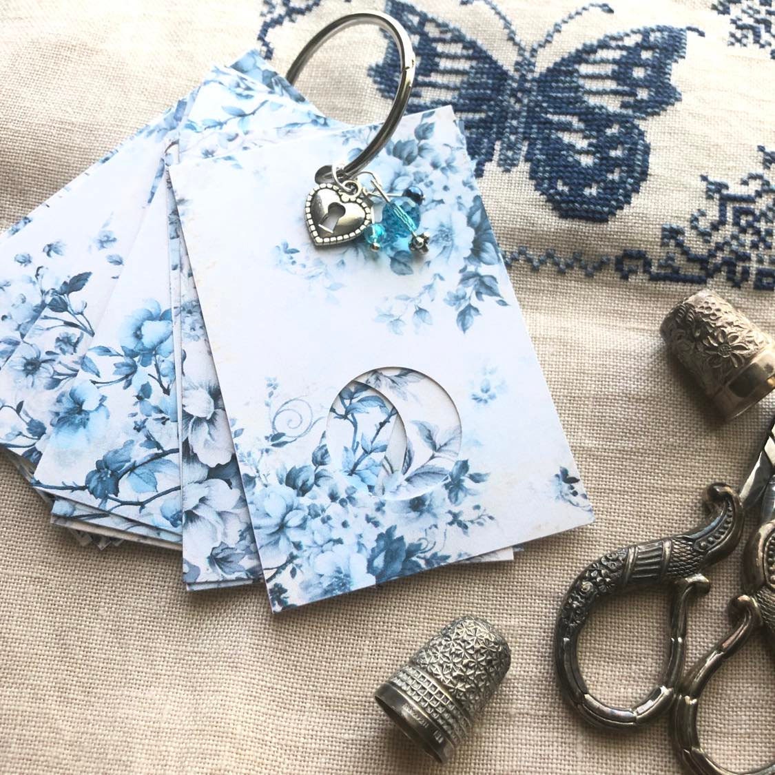 Blue floral themed floss drops for cross stitch thread organisation.