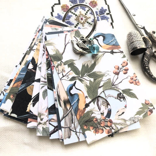 Floral birds themed floss drops for cross stitch thread organisation.